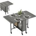Table pliante grise sur roulettes 130 x 80 x 74 cm, ideale pour petits espaces modulables